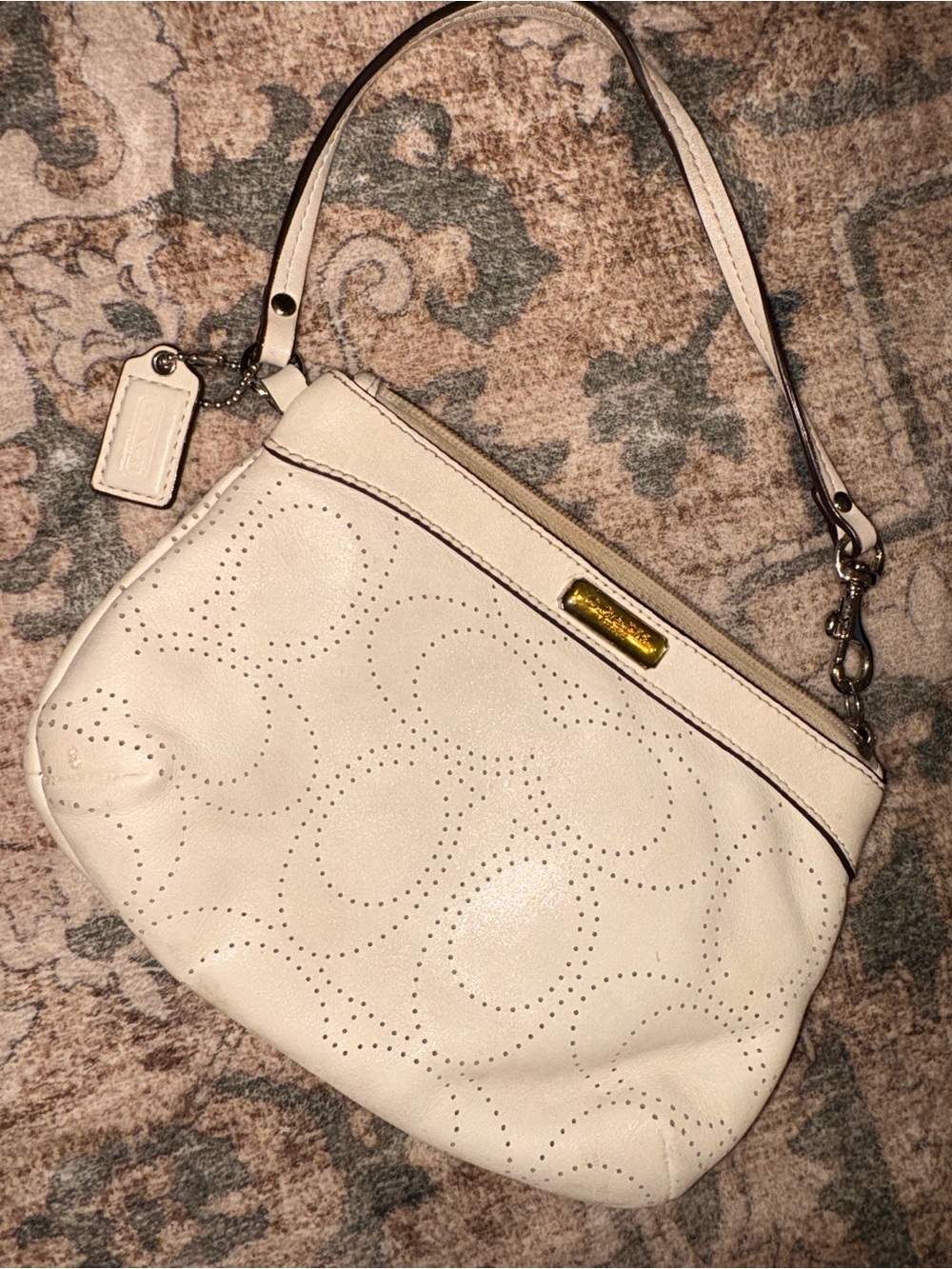 Coach Cream Perforated Leather wristlet Bag with Gold Plaque